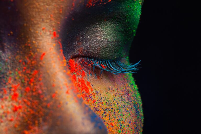 Eye of model with colorful art make-up, close-up