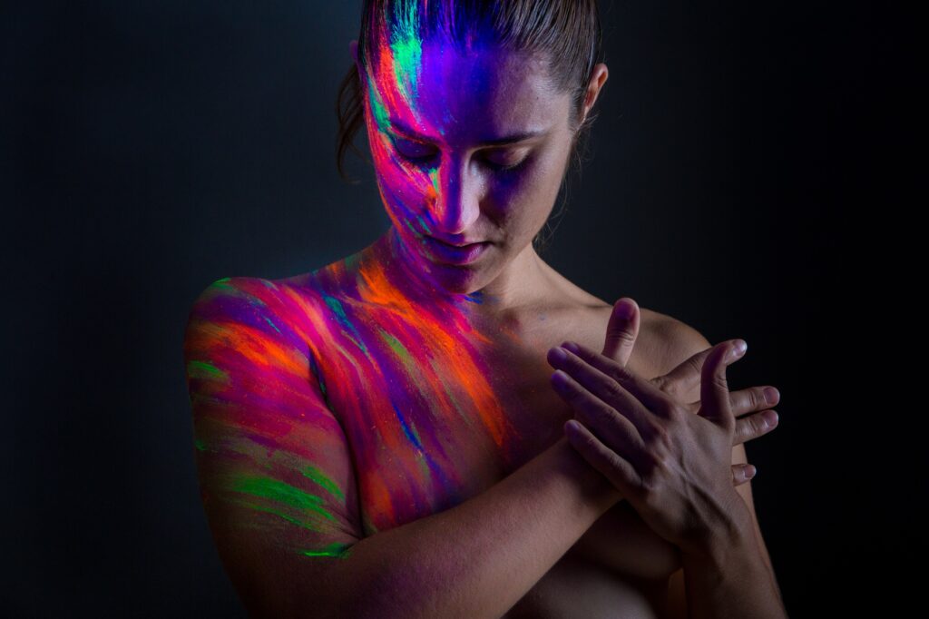 Topless model in neon lights